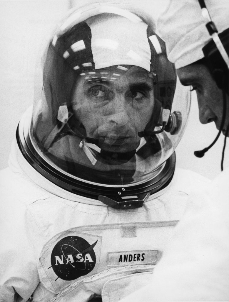 William Anders in a space suit and helmet